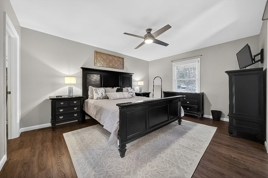 Primary with King Bed, two large dressers, two side tables, ceiling fan