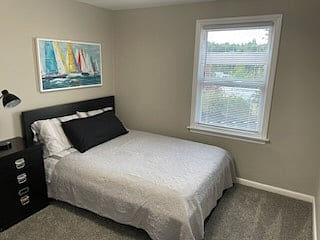 Upper Bedroom #2 with lots of natural light & a small computer desk