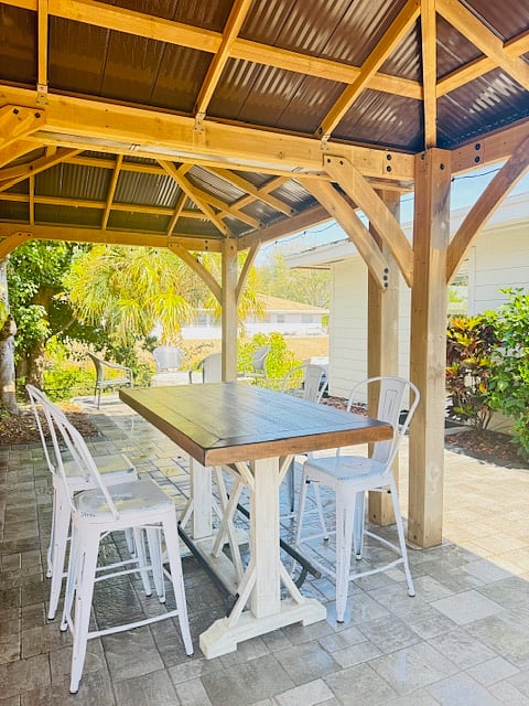 Enjoy a meal at the outdoor table under the gazebo 