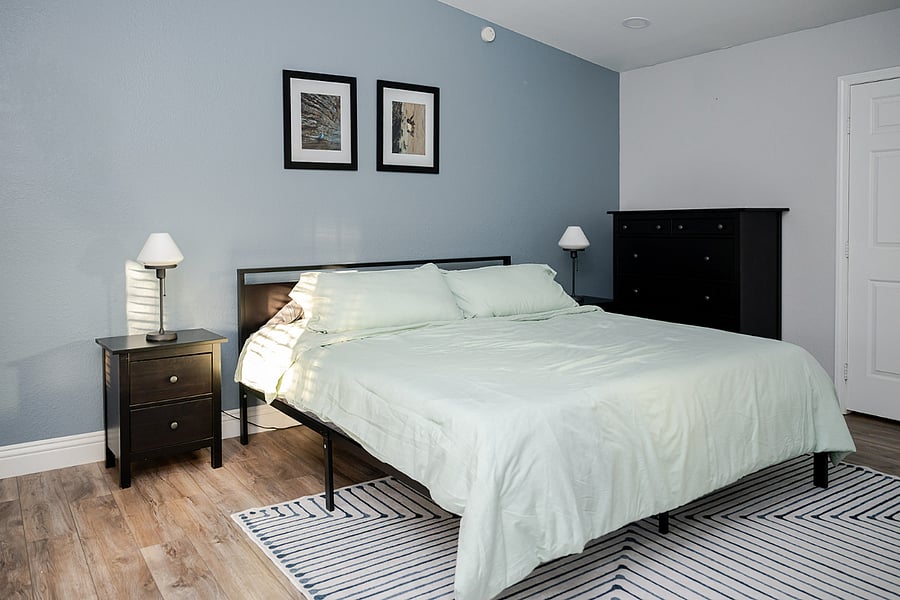 Primary bedroom with king bed and attached bath