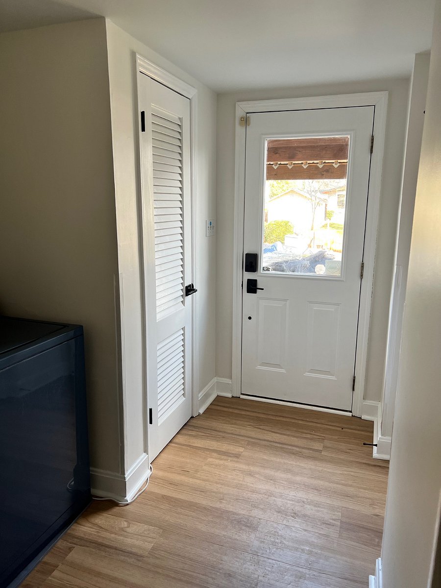 Exterior entrance to unit with full size washer and dryer.