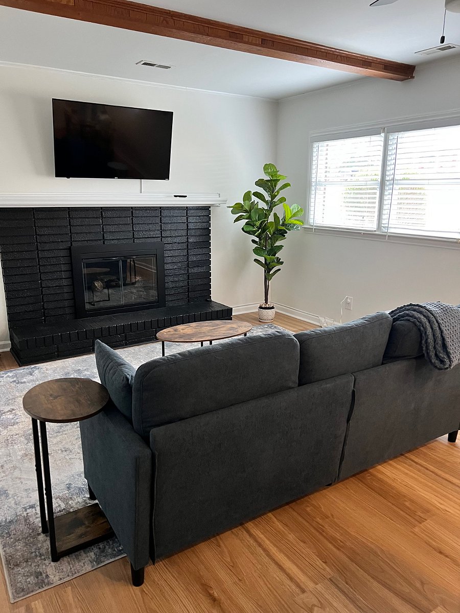 Living room with smart TV and couch.