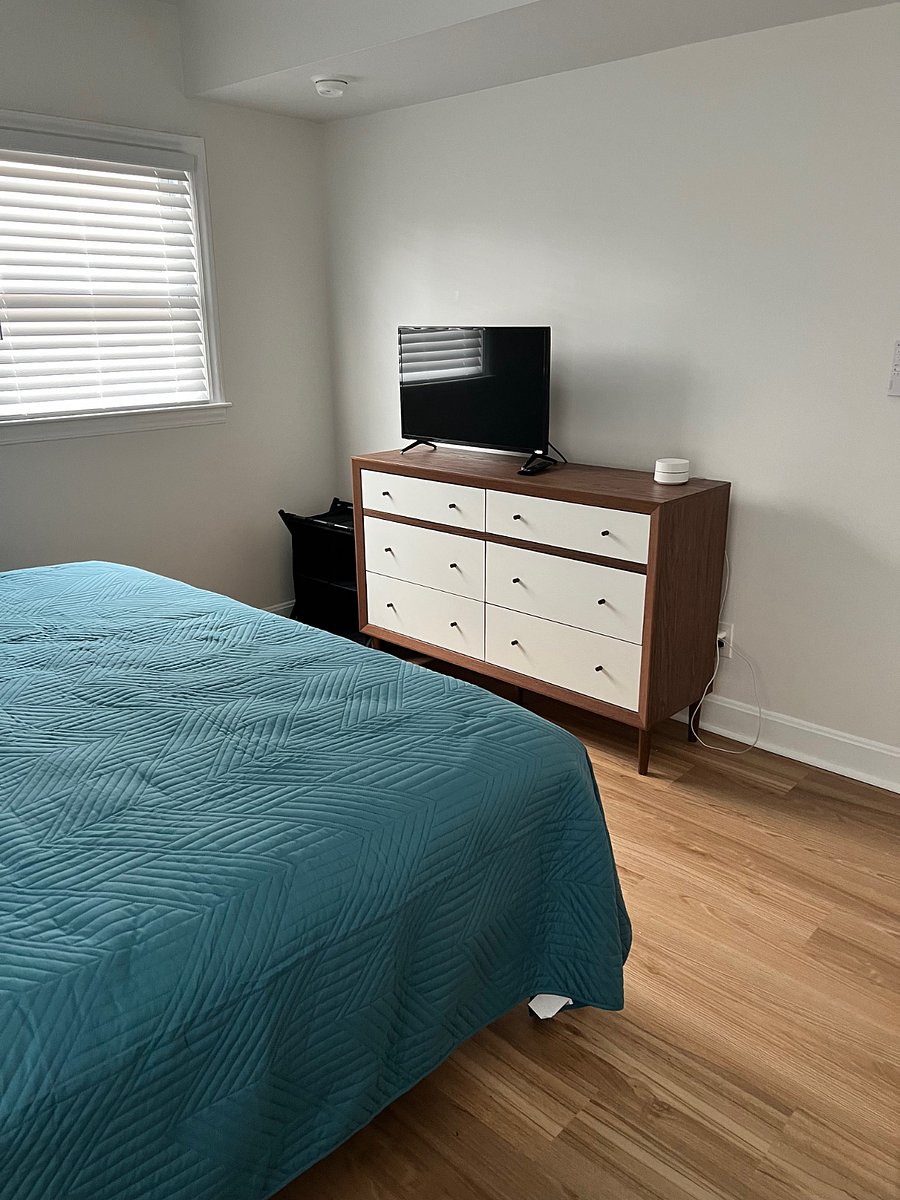 Full size dresser and TV with Roku in the bedroom
