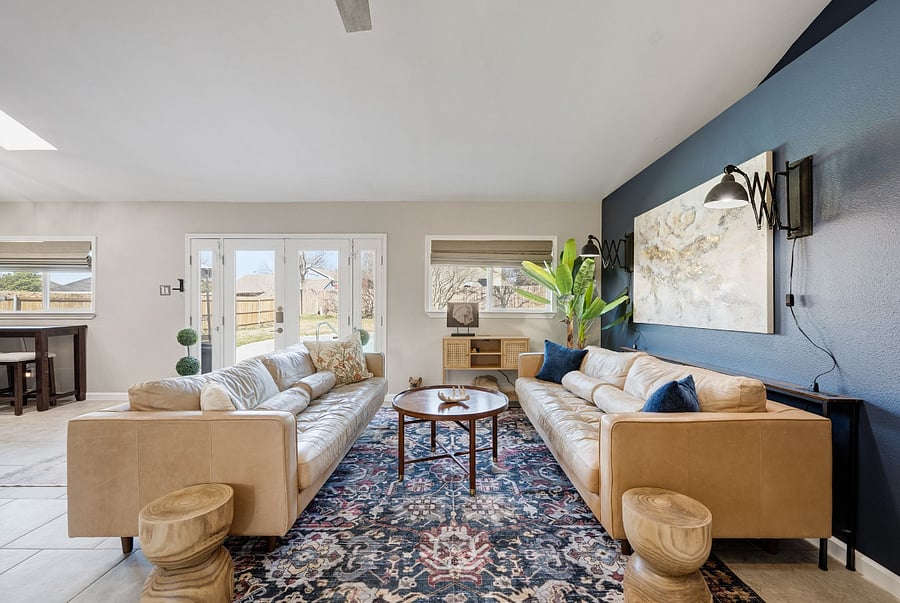 View facing the two leather sofas in Family room with view to pool