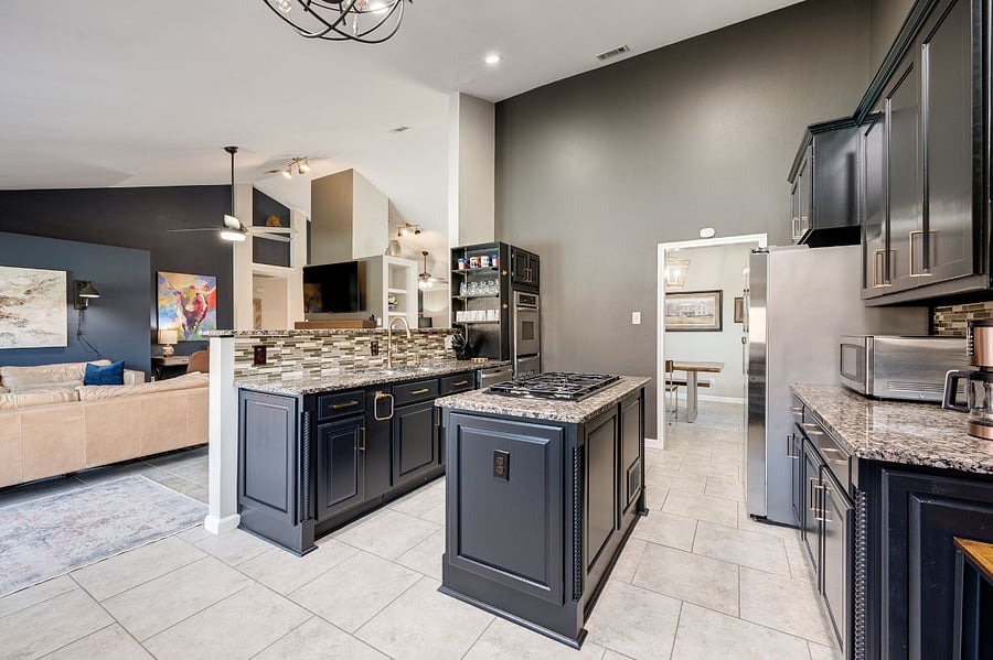 Open concept shows how large the kitchen is with views to pool and living room as well as dining room