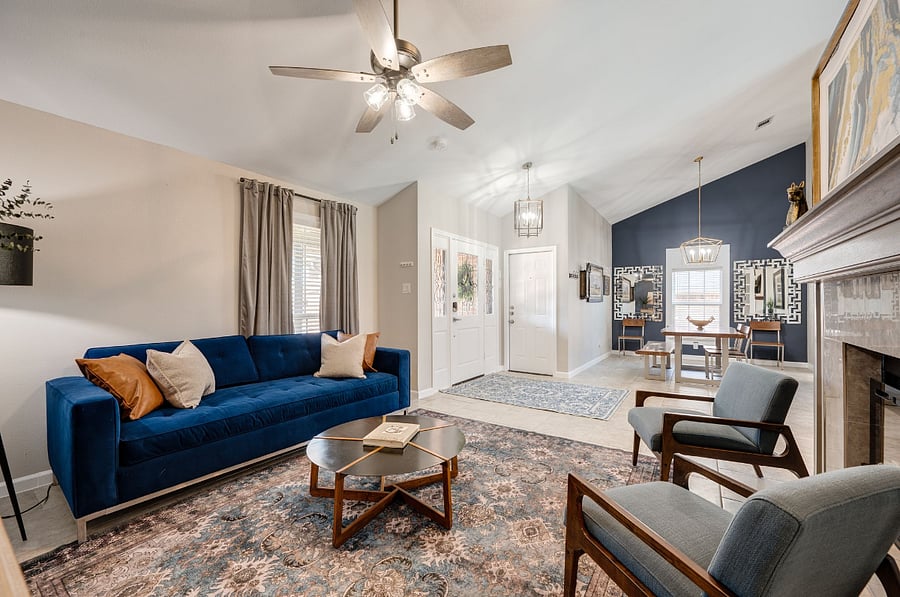 Front Living Room with queen sofa sleeper. The entry area from front door and the dining room featuring a large table for 6