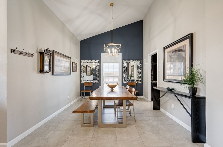 Over sized dining room features a live edge table and seating for 6.