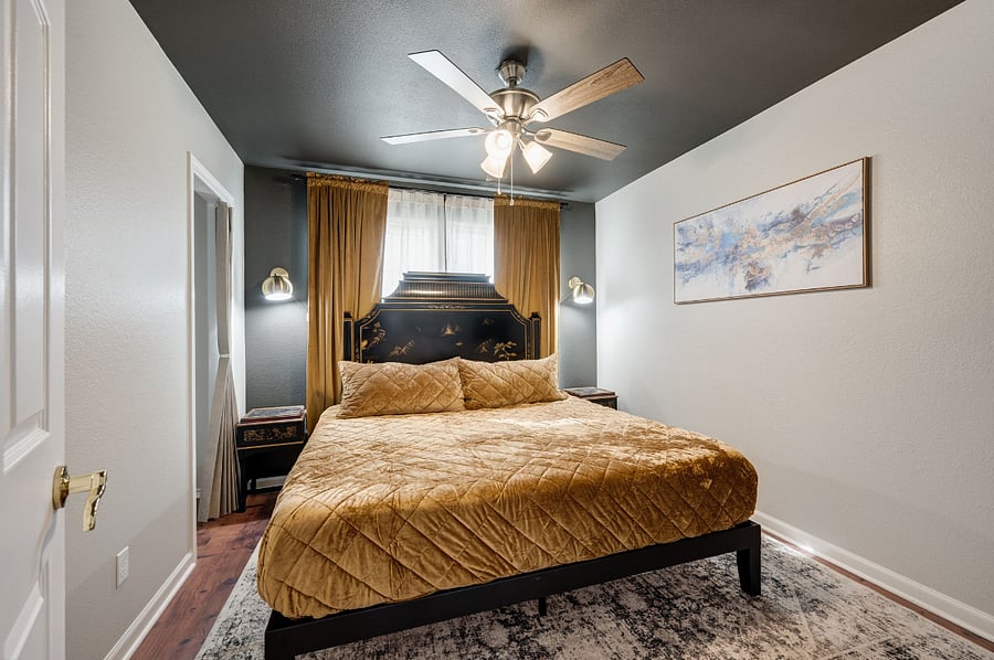 The Bronze Room (Bedroom #3) Features a Queen Size Bed with vintage chinoiserie headboard and night stands, warm SW Urbane Bronze accent walls
