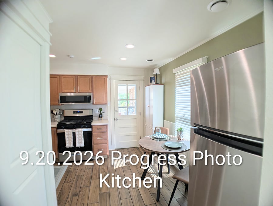 Entryway into Kitchen from Living Room - Brand new appliances. Artwork coming soon!