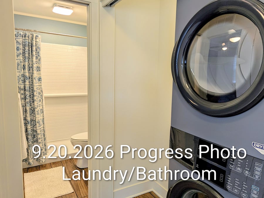 Hallway laundry and bathroom. We will be adding shelving and a countertop to the laundry room.