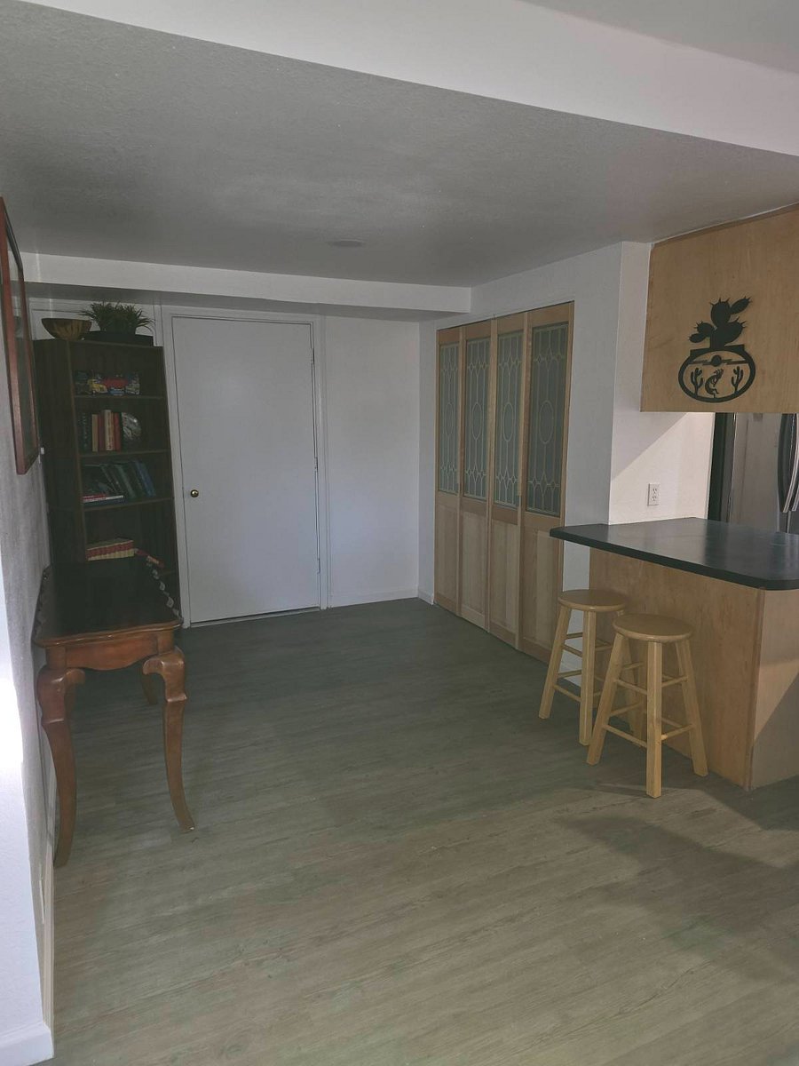 First level breakfast nook adjoining kitchenette and living room area & small library