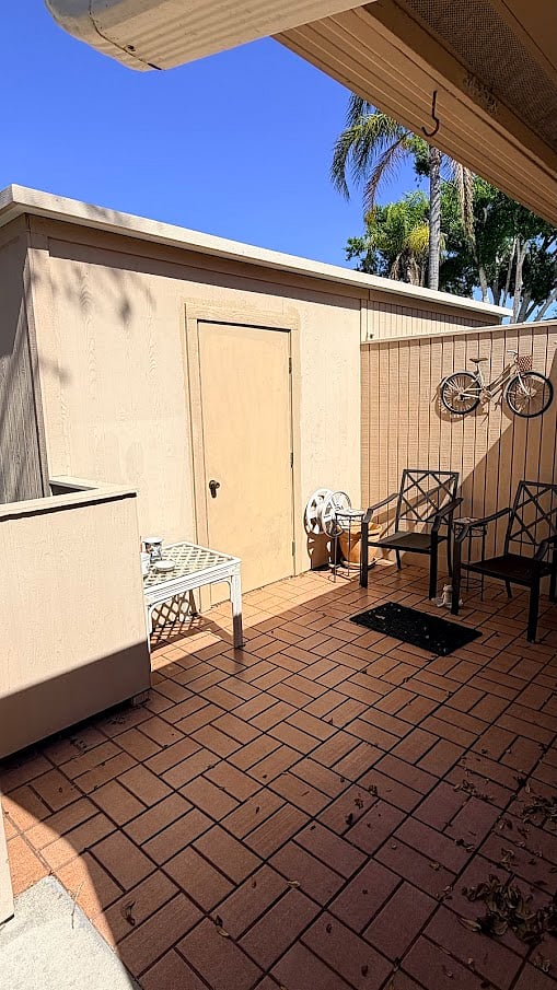 Front Patio Area off Master Bedroom. Door into Laundry / Storage room