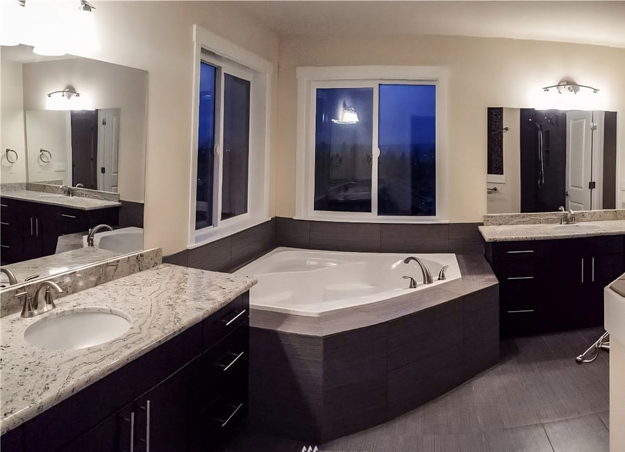 Bedroom 1: Primary large bathroom suite.