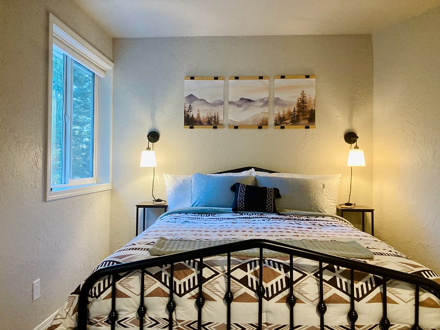 Spacious master bedroom looks out over the private yard & woods. Brand new queen size mattress & topper.