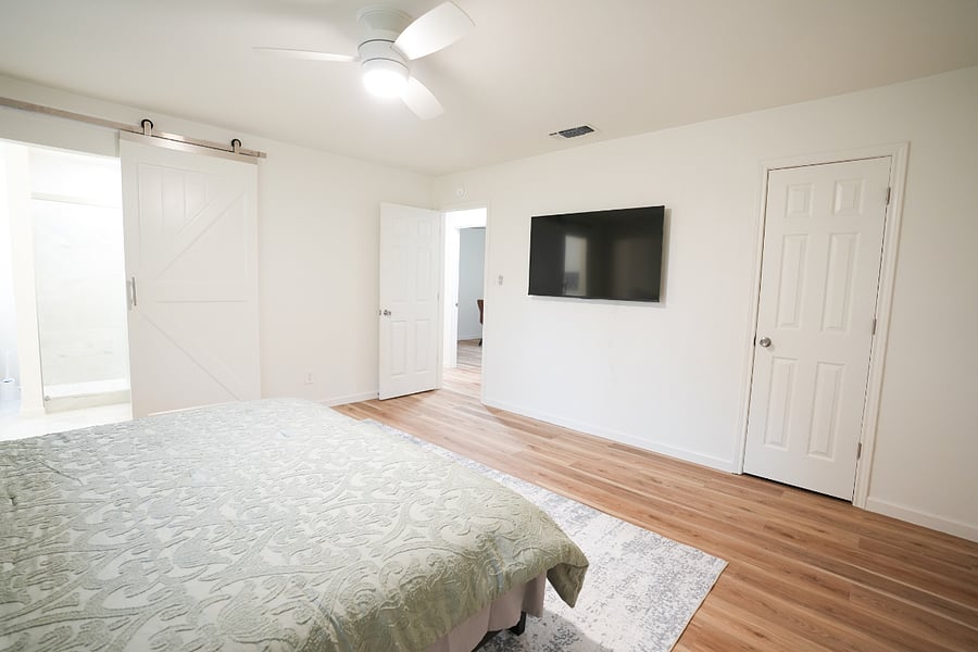 Spacious Master bedroom with a king size bed and large smart TV