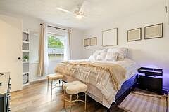 Bedroom 2, set up as king, angled view, light up nightstands with usb chargers