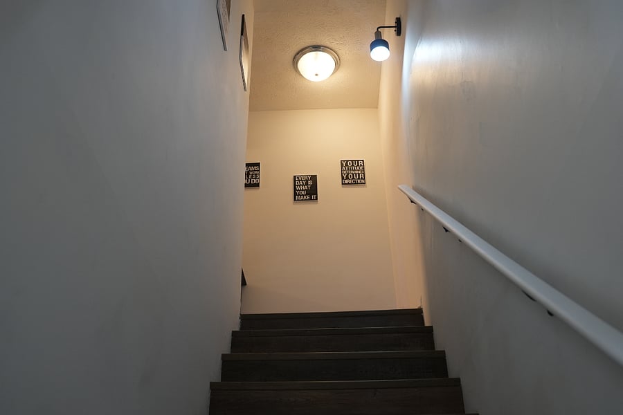 view up steps to reach both bedrooms and full bathroom.