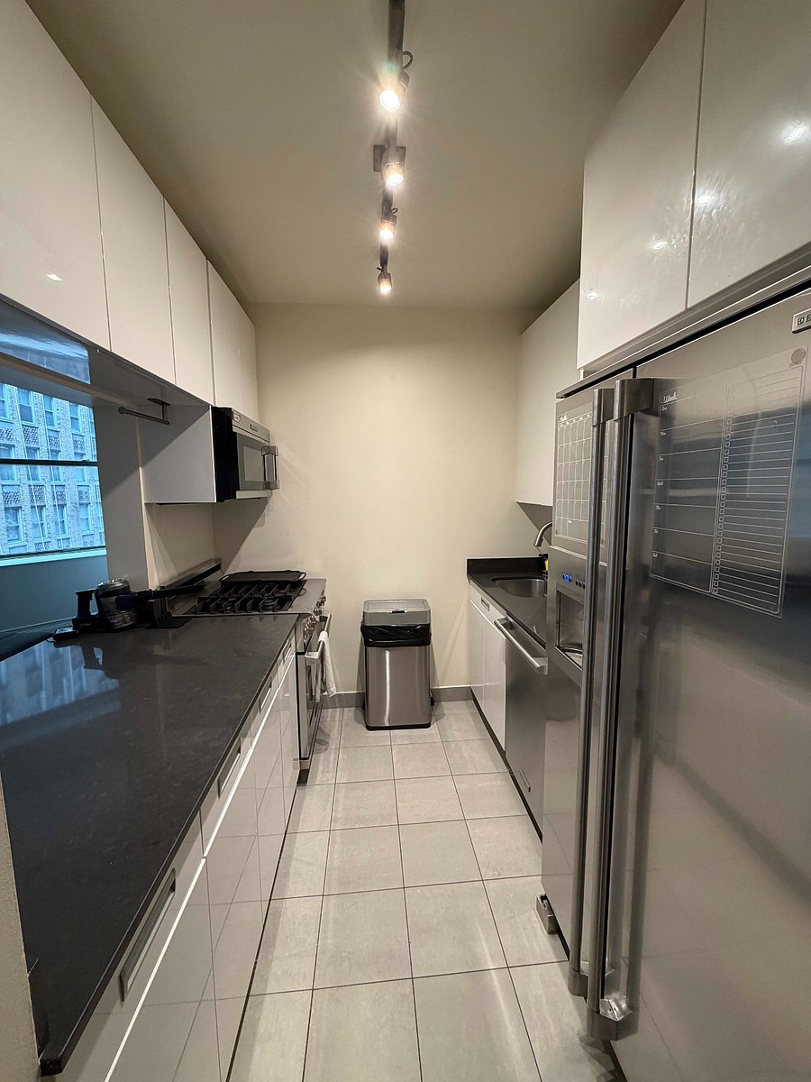 Full kitchen with window looking into the living room. Fully equipped including a Ninja 8-in-1 air fryer!
