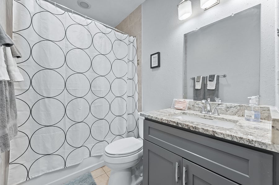 Tub and shower for relaxing after a long day of work or fun. Full linen closet (not pictured) on the other side of this photo