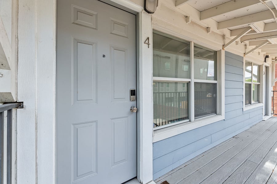 Keyless touchpad access from parking. Covered for setting groceries down. 