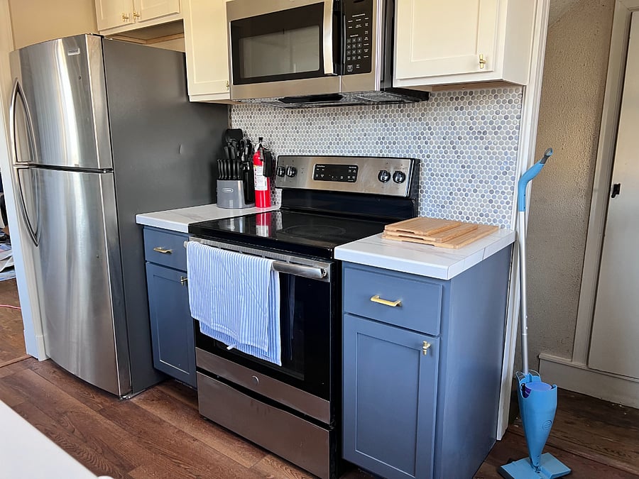 Kitchen with dishwasher, fridge, range, microwave