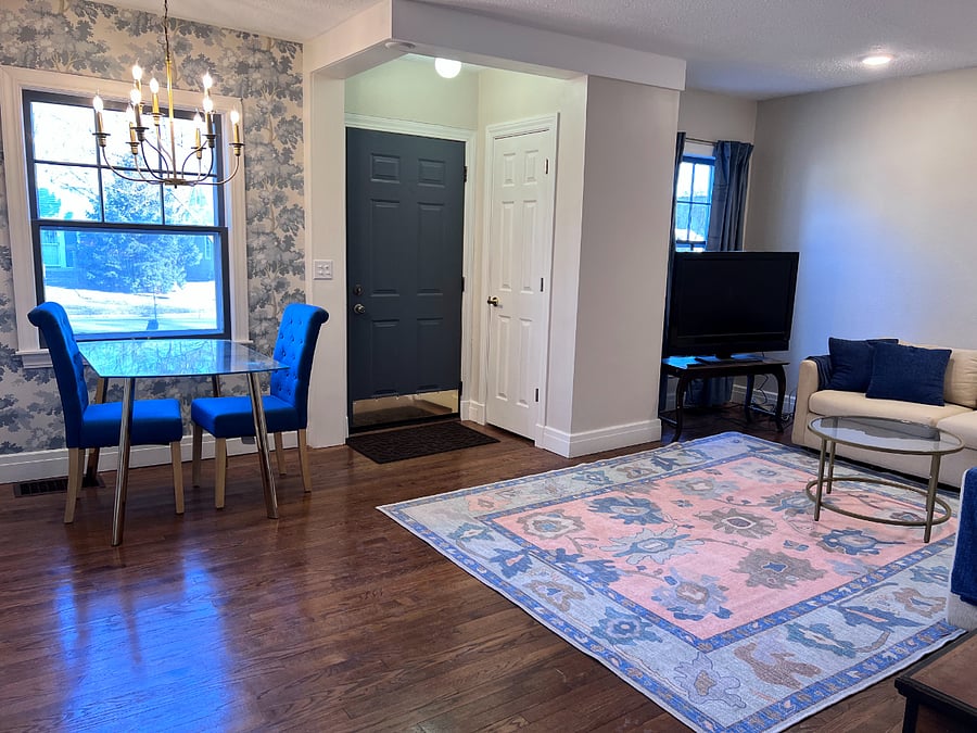 Dining area, living room, front door and coat closet