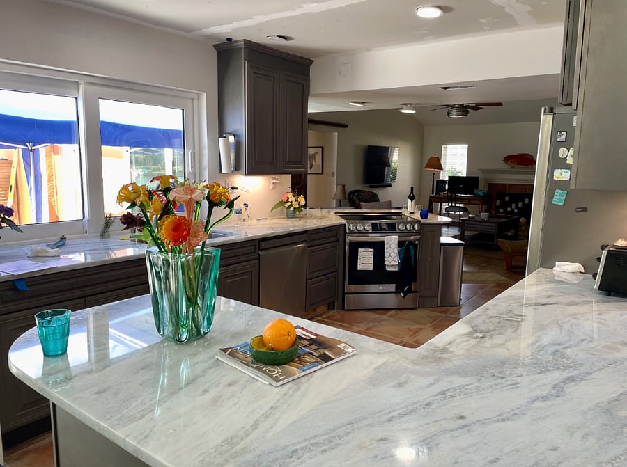 Natural, Dolomite stone kitchen counters still with the air fryer fridge with filtered water. 