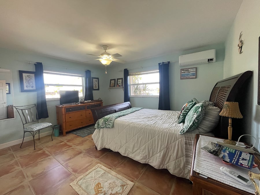 Queen size guest bedroom with secret door to bath.