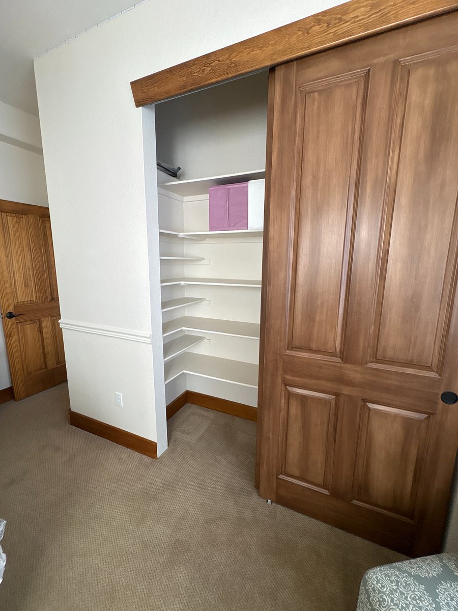 very spacious closet in white bedroom