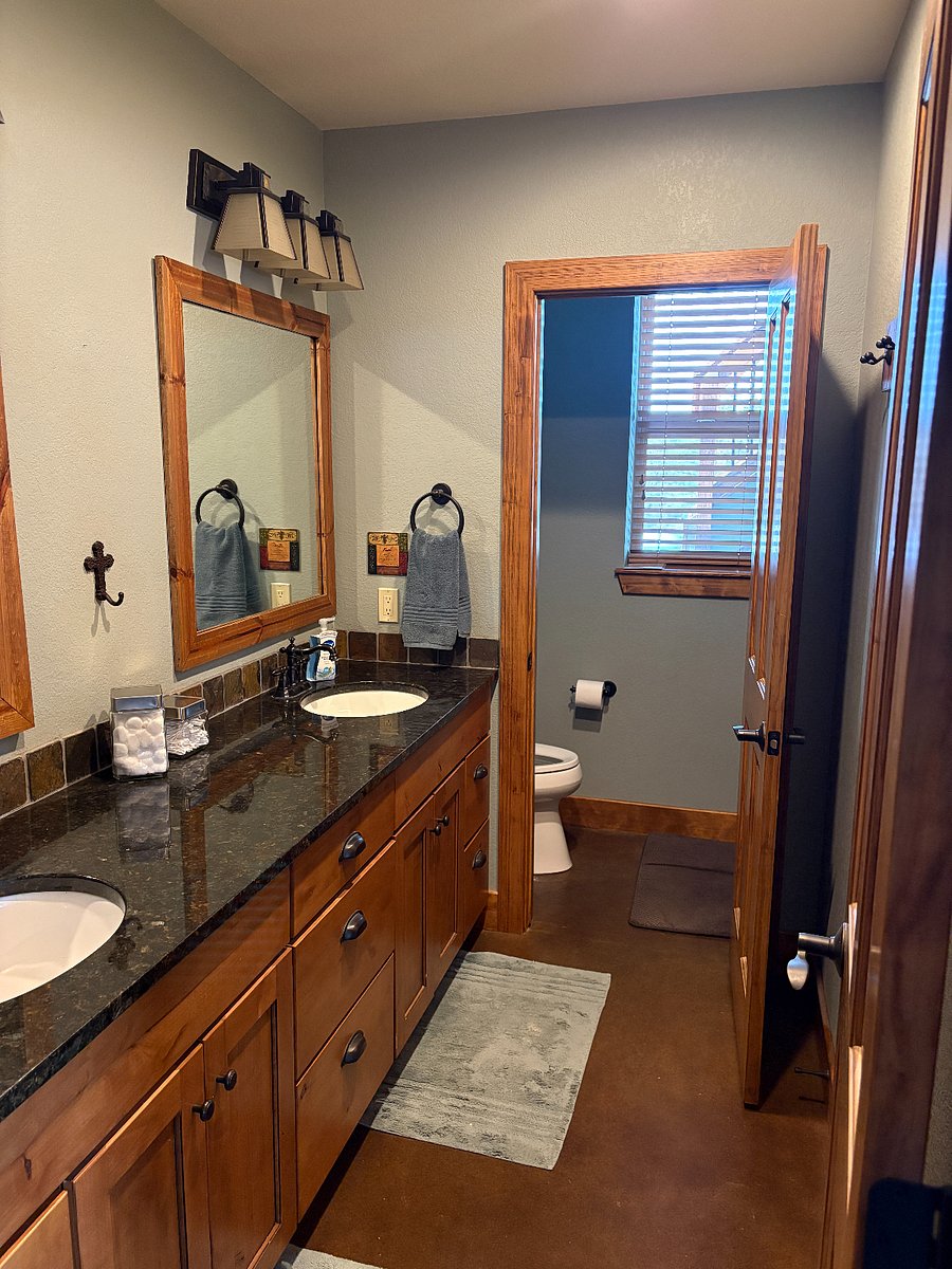 private bathroom with 2 sinks, high counter, lots of cupboards/drawers