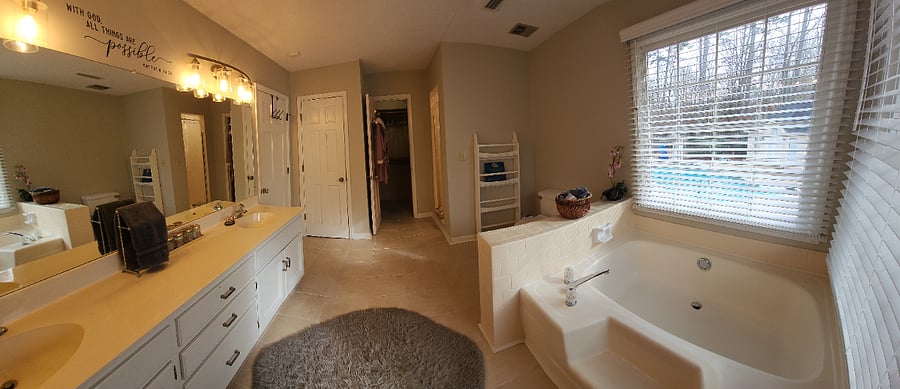 Master Bath with shower, tub, and walk in closet