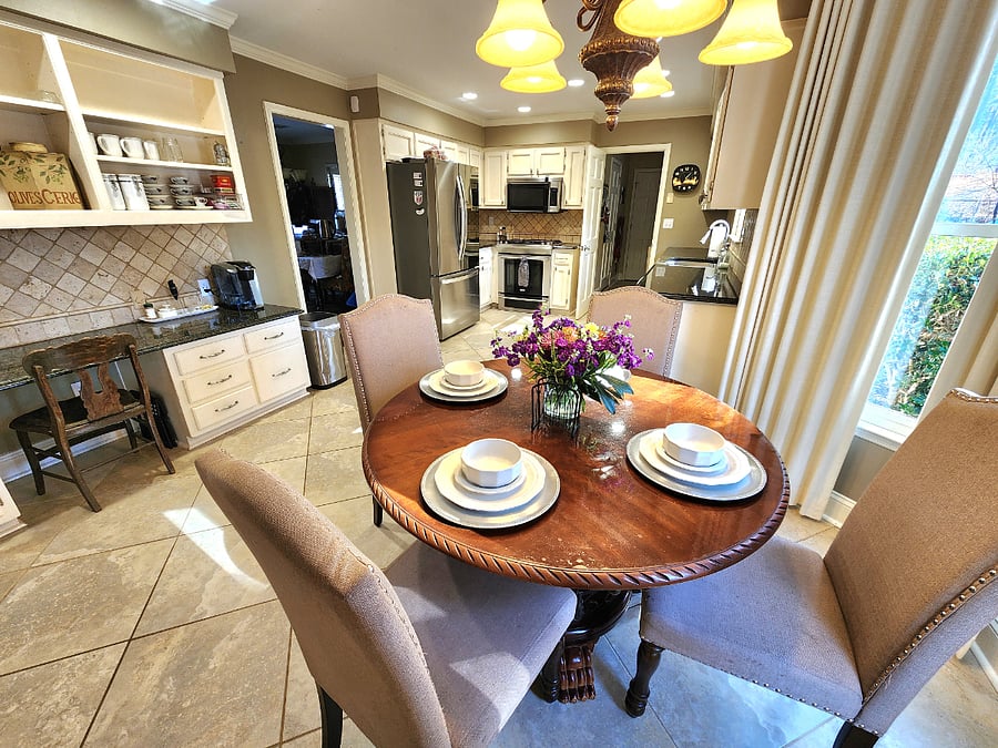 Dinette eat-in kitchen area overlooks pool