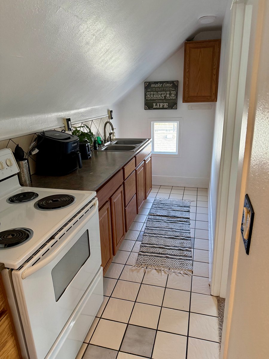 Full kitchen with everything needed to make a meal, including an air fryer.