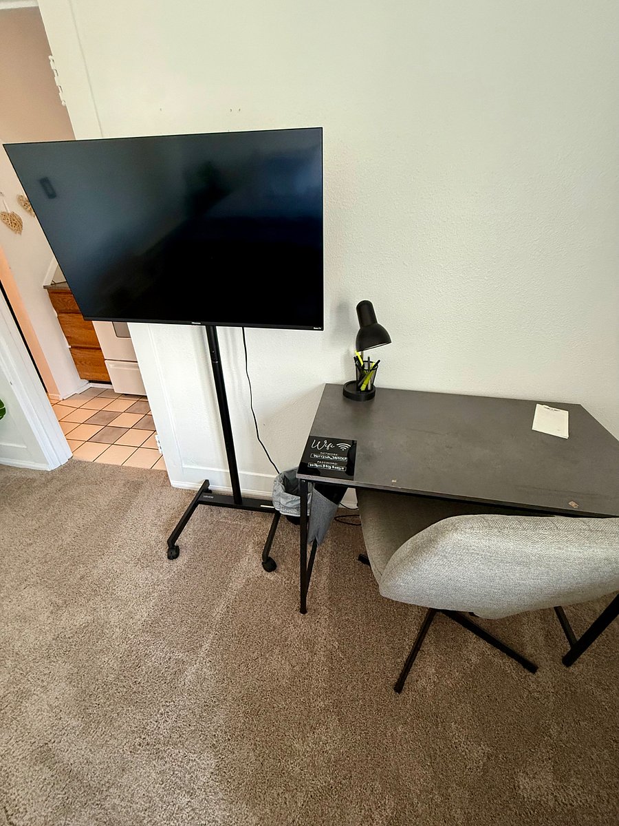 Desk with high-speed Wi-Fi information and TV.