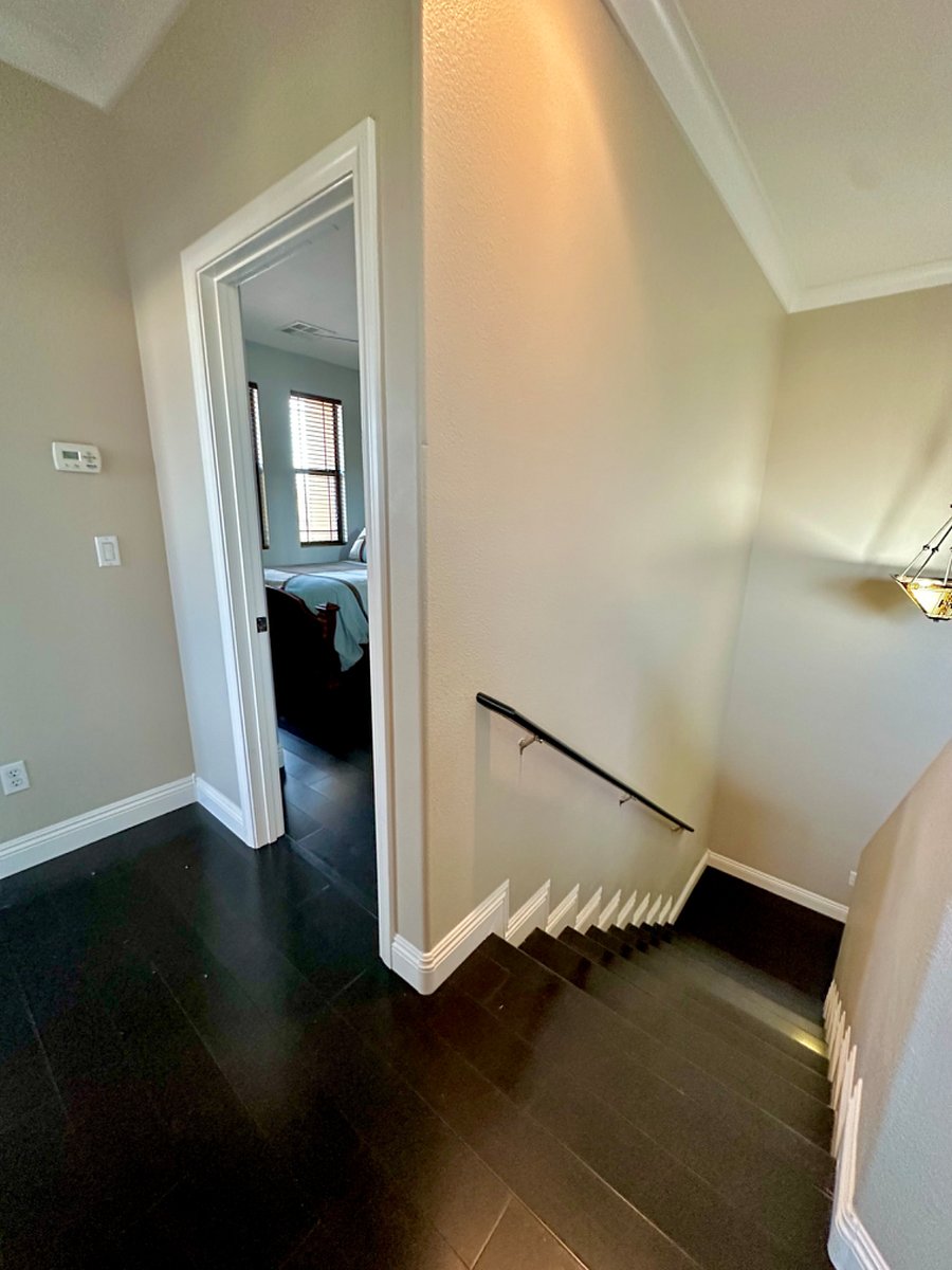 Your bedroom entrance at the top of the stairs, end of hallway.