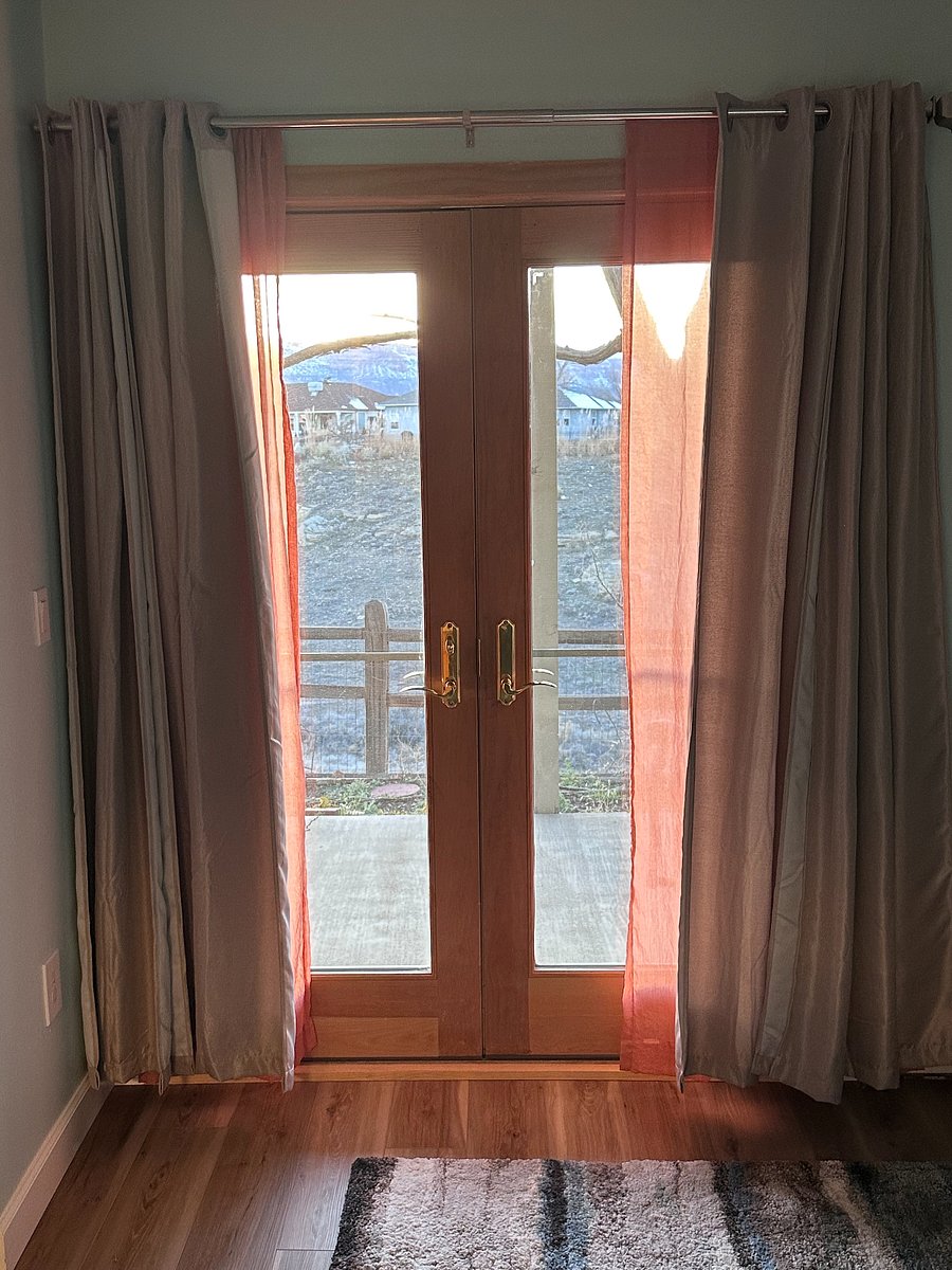 Master bedroom French doors leading to private patio