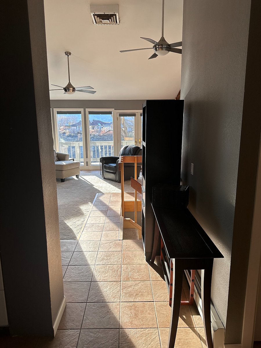 Hallway leading from foyer into living/dining room