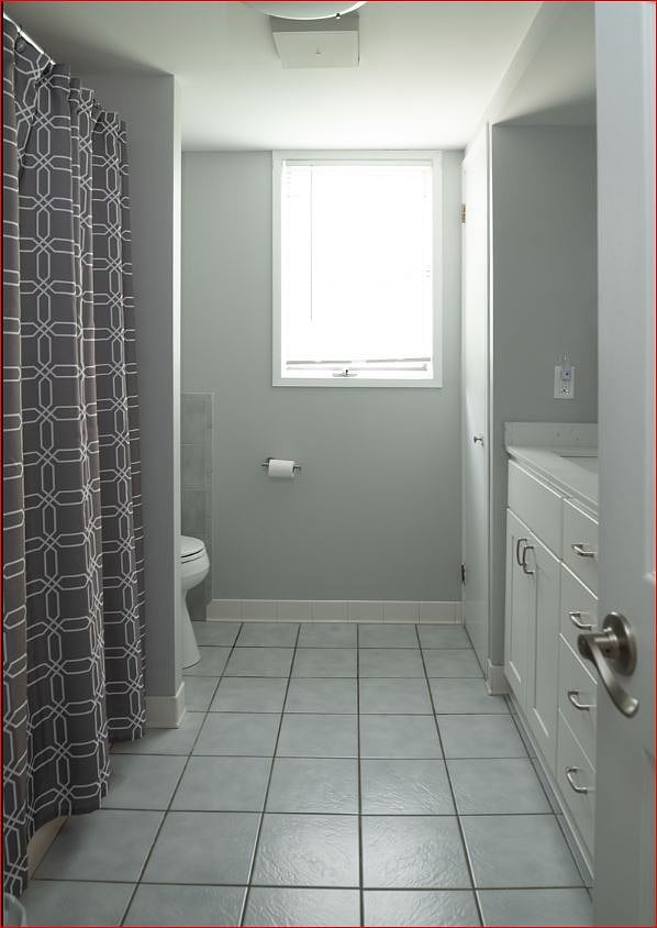 Main floor bathroom with tub and shower