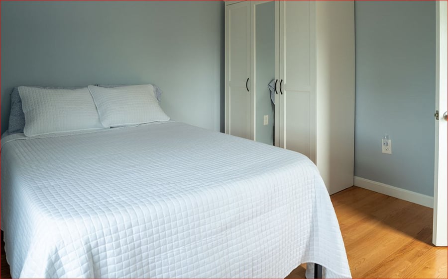 Second floor bedroom 2 of 2 with views of Point Judith Pond and the Port of Galilee