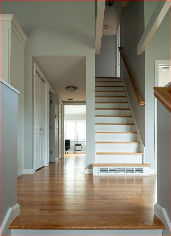 Main floor hallway to office/den and stairs to second floor