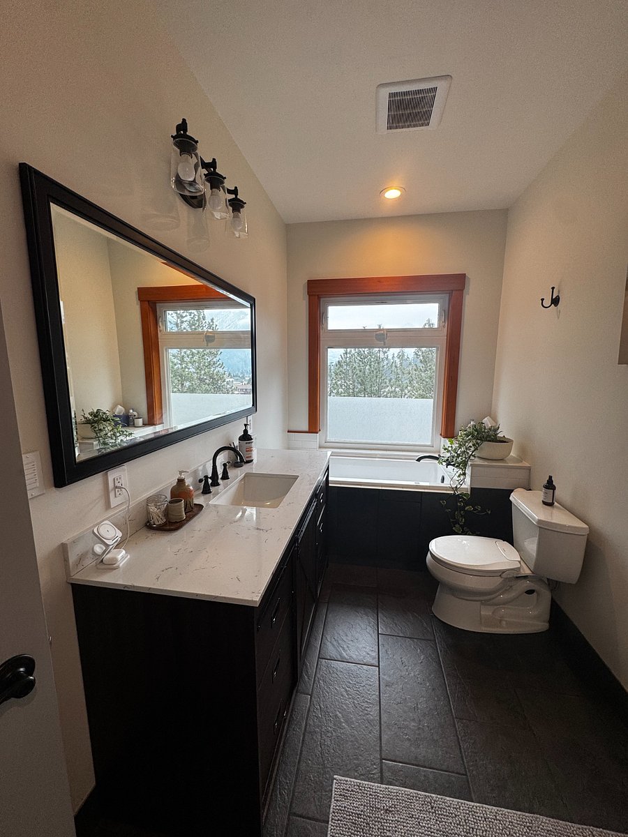 Primary bathroom features a lovely soaking tub as well as a shower.