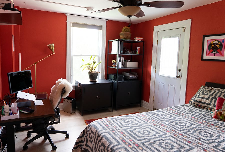 Bedroom #2 with standing desk and private balcony.