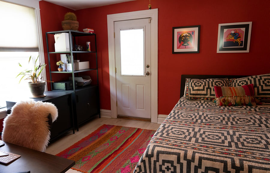 Bedroom #2 with standing desk and private balcony.