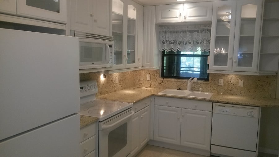 Kitchen with all cookware and dining ware.