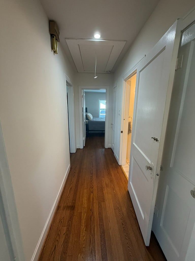 Hallway that leads to primary bath and master bedroom