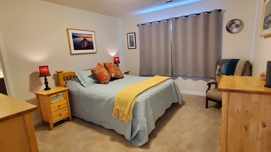 Main bedroom with light-blocking curtains.