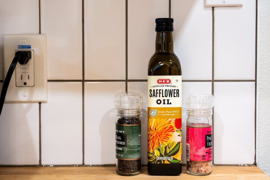 Kitchen counter with cooking oil, salt and pepper.