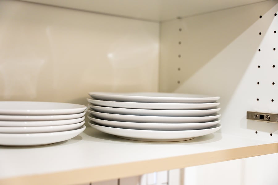 Kitchen cabinet shelf with dinnerware