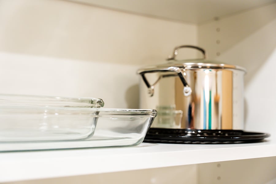 Kitchen cabinet shelf with additional cookware