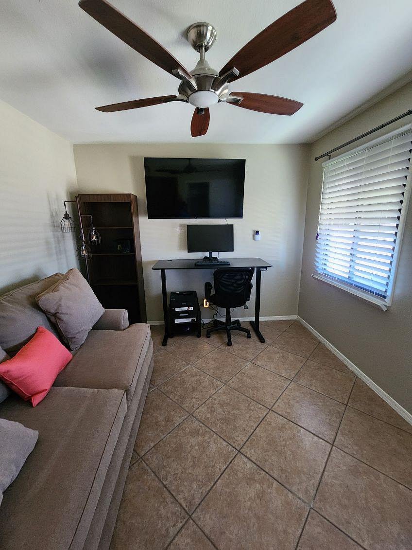 Front lake-view room with desk, monitor, printer and 55 inch smart streaming TV. Room has sofa bed with full size mattress.